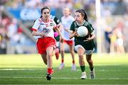12 July 2025; Ava Deacon, Kildavin National School, Kildavin, Carlow, representing Kerry, and Ava Owens, St Mary's Primary School, Teemore, Fermanagh, representing Tyrone, during the GAA INTO Cumann na mBunscol Respect Exhibition Go Games match at the GAA Football All-Ireland Senior Championship semi-final match between Kerry and Tyrone at Croke Park in Dublin. Photo by Seb Daly/Sportsfile