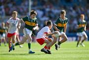 12 July 2025; Harry McVeigh, Bunscoil Bheanna Boirche, Castlewellan, Down, representing Tyrone, in action against James Dunne, Holy Family National School, Tubbercurry, Sligo, representing Kerry, and Sean Hurley, Gaelscoil Dr Uí Shuilleabháin, Gort Na Cloiche, Corcaigh, Ionadaíocht Ciarraí, left, during the GAA INTO Cumann na mBunscol Respect Exhibition Go Games match at the GAA Football All-Ireland Senior Championship semi-final match between Kerry and Tyrone at Croke Park in Dublin. Photo by Ray McManus/Sportsfile