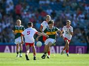 12 July 2025; Jamie Hoey, Scoil Eoin Phoil, Tullamore, Offaly, representing Kerry, is tackled by Harry McVeigh, Bunscoil Bheanna Boirche, Castlewellan, Down, representing Tyrone, during the GAA INTO Cumann na mBunscol Respect Exhibition Go Games match at the GAA Football All-Ireland Senior Championship semi-final match between Kerry and Tyrone at Croke Park in Dublin. Photo by Ray McManus/Sportsfile