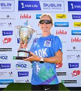 13 July 2025; Ann-Marie McGlynn of Letterkenny AC, Donegal, with the trophy after winning the women's 2025 Irish Life Dublin Race Series – Fingal 10km which took place on Sunday, 13th July at Swords in Dublin. Photo by Sam Barnes/Sportsfile