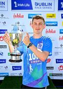 13 July 2025; Tadgh Donnelly of Drogheda and District AC, Louth, with the trophy after winning the men's 2025 Irish Life Dublin Race Series – Fingal 10km which took place on Sunday, 13th July at Swords in Dublin. Photo by Sam Barnes/Sportsfile