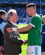 12 July 2025; Limerick businessman JP McManus shakes hands with Danny Neville of Limerick after the Tailteann Cup final match between Kildare and Limerick at Croke Park in Dublin. Photo by Ray McManus/Sportsfile