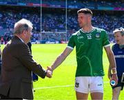 12 July 2025; Limerick businessman JP McManus shakes hands with Danny Neville of Limerick after the Tailteann Cup final match between Kildare and Limerick at Croke Park in Dublin. Photo by Ray McManus/Sportsfile