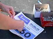13 July 2025; A runner prepares their race bib before the 2025 Irish Life Dublin Race Series – Fingal 10km which took place on Sunday, 13th July at Swords in Dublin. Photo by Sam Barnes/Sportsfile