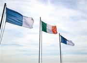 13 July 2025; The Irish tricolour is seen flying in the wind inbetween Laois and Monaghan flags before the TG4 All-Ireland Ladies Football Intermediate Championship semi-final match between Laois and Monaghan at Glennon Brothers Pearse Park in Longford. Photo by Thomas Flinkow/Sportsfile