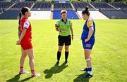 13 July 2025; Referee Angela Gallagher performs the coin-toss in the company of Louth captain Áine Breen, left, and Longford captain Eimear O'Brien before the TG4 All-Ireland Ladies Football Junior Championship semi-final match between Louth and Longford at St Tiernach’s Park in Clones, Monaghan. Photo by Ben McShane/Sportsfile