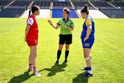 13 July 2025; Referee Angela Gallagher performs the coin-toss in the company of Louth captain Áine Breen, left, and Longford captain Eimear O'Brien before the TG4 All-Ireland Ladies Football Junior Championship semi-final match between Louth and Longford at St Tiernach’s Park in Clones, Monaghan. Photo by Ben McShane/Sportsfile