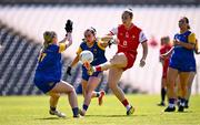 13 July 2025; Kate Flood of Louth is tackled by Ella Duggan, left, and Grace Kenny of Longford during the TG4 All-Ireland Ladies Football Junior Championship semi-final match between Louth and Longford at St Tiernach’s Park in Clones, Monaghan. Photo by Ben McShane/Sportsfile