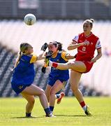 13 July 2025; Kate Flood of Louth is tackled by Ella Duggan, left, and Grace Kenny of Longford during the TG4 All-Ireland Ladies Football Junior Championship semi-final match between Louth and Longford at St Tiernach’s Park in Clones, Monaghan. Photo by Ben McShane/Sportsfile