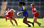 13 July 2025; Funmi Talabi of Longford in action against Zara Sweeney, left, and Lucy White of Louth during the TG4 All-Ireland Ladies Football Junior Championship semi-final match between Louth and Longford at St Tiernach’s Park in Clones, Monaghan. Photo by Ben McShane/Sportsfile