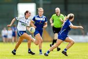 13 July 2025; Holly McQuiad of Monaghan in action against Faye McEvoy, back, and Andrea Moran of Laois during the TG4 All-Ireland Ladies Football Intermediate Championship semi-final match between Laois and Monaghan at Glennon Brothers Pearse Park in Longford. Photo by Thomas Flinkow/Sportsfile