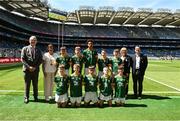 13 July 2025; Uachtarán Chumann Lúthchleas Gael Jarlath Burns, INTO President Anne Horan, President of Cumann na mBunscol, and Mini-Sevens co-ordinator Bernie Ryan, with the Meath team, back row, left to right, Mark Cunningham, St Mary's National School, Drumlish, Longford, Daniel Curran, Mayo National School, Crettyard, Laois, Trayvon Akahomen, St Mochta's National School, Clonsilla, Dublin, Adam O Cuill, Gaelscoil Mhic Easmainn, Trá Lí, Chiarraí, James Considine, Cooraclare National School, Cooraclare, Clare, fronnt row, left to right, Alex Travers, St. Corban's Boys National School, Naas, Kildare, David Judge, Bayside Senior School, Sutton, Dublin, Jack O'Connor, Ballylanders National School, Ballylanders, Limerick, Conor Doherty, Barraduff National School, Kerry, Ciarán Ryan, Barefield National School, Ennis, Clare, before the GAA INTO Cumann na mBunscol Respect Exhibition Go Games at the GAA Football All-Ireland Senior Championship semi-final match between Meath and Donegal at Croke Park in Dublin. Photo by Daire Brennan/Sportsfile