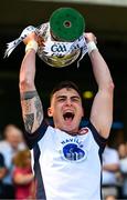 13 July 2025; New York captain Conor Mathers lifts the cup after his side's victory in the GAA Football All-Ireland Junior Championship final match between New York and London at Croke Park in Dublin Photo by Ray McManus/Sportsfile