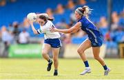 13 July 2025; Lauren Garland of Monaghan in action against Eva Galvin of Laois during the TG4 All-Ireland Ladies Football Intermediate Championship semi-final match between Laois and Monaghan at Glennon Brothers Pearse Park in Longford. Photo by Thomas Flinkow/Sportsfile