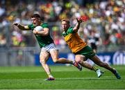 13 July 2025; Eoghan Frayne of Meath in action against Oisin Gallen of Donegal the GAA Football All-Ireland Senior Championship semi-final match between Meath and Donegal at Croke Park in Dublin. Photo by Piaras Ó Mídheach/Sportsfile