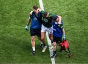 13 July 2025; Bryan Menton of Meath is assisted off the field during the GAA Football All-Ireland Senior Championship semi-final match between Meath and Donegal at Croke Park in Dublin. Photo by Daire Brennan/Sportsfile