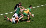 13 July 2025; Finnbarr Roarty of Donegal in action against Meath players, left to right, Ruairí Kinsella, Billy Hogan, and Ronan Ryan during the GAA Football All-Ireland Senior Championship semi-final match between Meath and Donegal at Croke Park in Dublin. Photo by Daire Brennan/Sportsfile