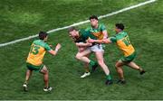 13 July 2025; Mathew Costello of Meath in action against Donegal players, left to right, Ciaran Moore, Odhran McFadden Ferry, and Conor O'Donnell during the GAA Football All-Ireland Senior Championship semi-final match between Meath and Donegal at Croke Park in Dublin. Photo by Daire Brennan/Sportsfile