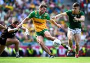 13 July 2025; Conor O'Donnell of Donegal scores his side's third goal under pressure from Meath goalkeeper Billy Hogan and Eoghan Frayne of Meath during the GAA Football All-Ireland Senior Championship semi-final match between Meath and Donegal at Croke Park in Dublin. Photo by Piaras Ó Mídheach/Sportsfile