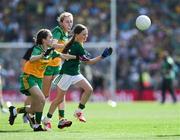 13 July 2025; Sara Donegan, Bennekerry National School, Bennekerry, Carlow, representing Meath, is tackled by Síne Nic Giolla Chomhaill, Gaelscoil Ultain, Baile Mhuineacháin, Mhuineacháin, ag déanamh ionadaíochta ar Dhún na nGall and Mischa McNulty, Gortletteragh National School, Gortletteragh, Leitrim, representing Donegal, during the GAA INTO Cumann na mBunscol Respect Exhibition Go Games match at the GAA Football All-Ireland Senior Championship semi-final match between Meath and Donegal at Croke Park in Dublin. Photo by Ray McManus/Sportsfile