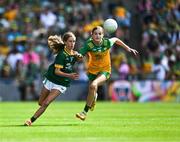 13 July 2025; Holly Brady, Scoil Mhuire, Newtownforbes, Longford, representing Meath, in action against Siún Crowe, Scoil Mhuire, Lacken, Cavan, representing Donegal, during the GAA INTO Cumann na mBunscol Respect Exhibition Go Games match at the GAA Football All-Ireland Senior Championship semi-final match between Meath and Donegal at Croke Park in Dublin. Photo by Ray McManus/Sportsfile