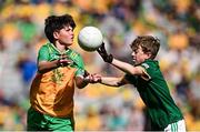 13 July 2025; Theodore O'Brien, Maree National School, Oranmore, Galway, representing Donegal, in action against David Judge, Bayside Senior School, Sutton, Dublin, representing Meath, during the GAA INTO Cumann na mBunscol Respect Exhibition Go Games match at the GAA Football All-Ireland Senior Championship semi-final match between Meath and Donegal at Croke Park in Dublin. Photo by Seb Daly/Sportsfile