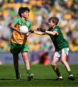 13 July 2025; Theodore O'Brien, Maree National School, Oranmore, Galway, representing Donegal, in action against David Judge, Bayside Senior School, Sutton, Dublin, representing Meath, during the GAA INTO Cumann na mBunscol Respect Exhibition Go Games match at the GAA Football All-Ireland Senior Championship semi-final match between Meath and Donegal at Croke Park in Dublin. Photo by Seb Daly/Sportsfile