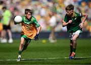 13 July 2025; Oisin Carr, St Francis National School, Barnesmore, Donegal, representing Donegal, in action against Daniel Curran, Mayo National School, Crettyard, Laois, representing Meath, during the GAA INTO Cumann na mBunscol Respect Exhibition Go Games match at the GAA Football All-Ireland Senior Championship semi-final match between Meath and Donegal at Croke Park in Dublin. Photo by Seb Daly/Sportsfile