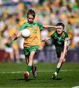 13 July 2025; Donnacha Mulligan, Scoil Mhuire, Moycullen, Galway, representing Donegal, in action against Conor Doherty, Barraduff National School, Barrafuff, Kerry, representing Meath, during the GAA INTO Cumann na mBunscol Respect Exhibition Go Games match at the GAA Football All-Ireland Senior Championship semi-final match between Meath and Donegal at Croke Park in Dublin. Photo by Seb Daly/Sportsfile