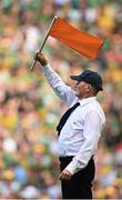 13 July 2025; An umpire waves the orange flag to indicate a two-point score during the GAA Football All-Ireland Senior Championship semi-final match between Meath and Donegal at Croke Park in Dublin. Photo by Seb Daly/Sportsfile