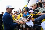 14 July 2025; Rory McIlroy of Northern Ireland signs autographs after a practice round at Royal Portrush Golf Club in Portrush, Antrim, ahead of The 153rd Open Championship. Photo by Ramsey Cardy/Sportsfile