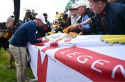 14 July 2025; Rory McIlroy of Northern Ireland signs autographs after a practice round at Royal Portrush Golf Club in Portrush, Antrim, ahead of The 153rd Open Championship. Photo by Ramsey Cardy/Sportsfile