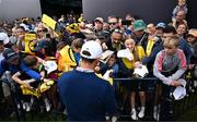 14 July 2025; Rory McIlroy of Northern Ireland signs autographs after a practice round at Royal Portrush Golf Club in Portrush, Antrim, ahead of The 153rd Open Championship. Photo by Ramsey Cardy/Sportsfile