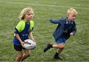 14 July 2025; Owen Cannon, left, during a Bank of Ireland Leinster Rugby Summer Camp at Energia Park in Dublin. Photo by Piaras Ó Mídheach/Sportsfile