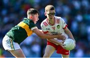 12 July 2025; Sean Luke McCann, St. Oliver Plunkett's Primary School, Ballyhegan, Armagh, representing Tyrone, in action against Robert Flynn, Scoil Mhuire, Newtownforbes, Longford, representing Kerry, during the GAA INTO Cumann na mBunscol Respect Exhibition Go Games match at the GAA Football All-Ireland Senior Championship semi-final match between Kerry and Tyrone at Croke Park in Dublin. Photo by Piaras Ó Mídheach/Sportsfile