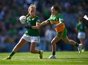 13 July 2025; Kate McKeon, Gaelscoil Dhún Dealgan, Dún Dealgan, Co Lú, ag ionadú na Mí, in action against Ella Gillespie, St. Joseph's Primary School, Galbally, Tyrone, representing Donegal, during the GAA INTO Cumann na mBunscol Respect Exhibition Go Games match at the GAA Football All-Ireland Senior Championship semi-final match between Meath and Donegal at Croke Park in Dublin. Photo by Piaras Ó Mídheach/Sportsfile