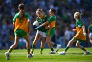 13 July 2025; Kate McKeon, Gaelscoil Dhún Dealgan, Dún Dealgan, Co Lú, ag ionadú na Mí, in action against Ella Gillespie, St. Joseph's Primary School, Galbally, Tyrone, representing Donegal, during the GAA INTO Cumann na mBunscol Respect Exhibition Go Games match at the GAA Football All-Ireland Senior Championship semi-final match between Meath and Donegal at Croke Park in Dublin. Photo by Piaras Ó Mídheach/Sportsfile