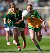 13 July 2025; Mollie Doogan Burke, Scoil Bhríde, Mullaghrafferty, Monaghan, representing Donegal, in action against Holly Brady, Scoil Mhuire, Newtownforbes, Longford, representing Meath, during the GAA INTO Cumann na mBunscol Respect Exhibition Go Games match at the GAA Football All-Ireland Senior Championship semi-final match between Meath and Donegal at Croke Park in Dublin. Photo by Piaras Ó Mídheach/Sportsfile