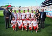 12 July 2025; Uachtarán Chumann Lúthchleas Gael Jarlath Burns, INTO President Anne Horan, LGFA President Trina Murray and Gary Farrell, President, Cumann na mBunscol with the Tyrone team; back row, from left; Logan Gibson, The Good Shepherd Primary School, Lucas O Cinsealaigh, Scoil Oilibheir, Cluain Saielach, Átha Cliath, Edwin Tynan, Church Hill National School, Sean Luke McCann, St. Oliver Plunkett's Primary School, Ballyhegan, Armagh, and Tadhg McCormack, St. Conleth's National School, and back row, from left, Jake Mallon, St. Malachy's Primary School, Chapel Lane, Armagh, Daniel Blake, Tinahely National School, Tinahely, Wicklow, Harry McVeigh, Bunscoil Bheanna Boirche, Castlewellan, Down, Cillian Kearns, St. Bernard's Primary School, Wynchurch Walk, Antrim, and Harry Stranney, Cedar Integrated Primary School, Crossgar, Down, before the GAA INTO Cumann na mBunscol Respect Exhibition Go Games at the GAA Football All-Ireland Senior Championship semi-final match between Meath and Donegal at Croke Park in Dublin. Photo by Piaras Ó Mídheach/Sportsfile
