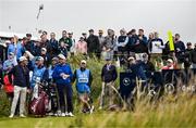 15 July 2025; Collin Morikawa of USA takes a tee shot as Shane Lowry of Ireland, left, looks on during a practice round at Royal Portrush Golf Club in Portrush, Antrim, ahead of The 153rd Open Championship. Photo by Ramsey Cardy/Sportsfile