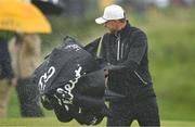 15 July 2025; Ludvig Aberg of Sweden shakes his umbrella during a practice round at Royal Portrush Golf Club in Portrush, Antrim, ahead of The 153rd Open Championship. Photo by Ramsey Cardy/Sportsfile