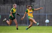 15 July 2025; Laura Boyle of Donegal has a shot on goal despite the attention of Jane Hanrahan of Leitrim during LGFA All-Ireland U16 C Championship final match between Donegal and Leitrim at Tempo Maguires GAC in Tempo, Fermanagh. Photo by Ben McShane/Sportsfile