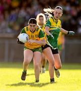15 July 2025; Eva McNamara of Donegal is tackled by Grace Devaney of Leitrim during LGFA All-Ireland U16 C Championship final match between Donegal and Leitrim at Tempo Maguires GAC in Tempo, Fermanagh. Photo by Ben McShane/Sportsfile
