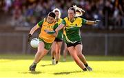 15 July 2025; Eva McNamara of Donegal is tackled by Grace Devaney of Leitrim during LGFA All-Ireland U16 C Championship final match between Donegal and Leitrim at Tempo Maguires GAC in Tempo, Fermanagh. Photo by Ben McShane/Sportsfile