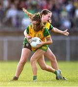 15 July 2025; Laura Boyle of Donegal is tackled by Lucie Maye of Leitrim during LGFA All-Ireland U16 C Championship final match between Donegal and Leitrim at Tempo Maguires GAC in Tempo, Fermanagh. Photo by Ben McShane/Sportsfile