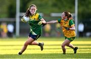 15 July 2025; Eibhlin Guckian of Leitrim in action against Rachel Gillespie of Donegal during LGFA All-Ireland U16 C Championship final match between Donegal and Leitrim at Tempo Maguires GAC in Tempo, Fermanagh. Photo by Ben McShane/Sportsfile