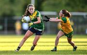 15 July 2025; Eibhlin Guckian of Leitrim in action against Rachel Gillespie of Donegal during LGFA All-Ireland U16 C Championship final match between Donegal and Leitrim at Tempo Maguires GAC in Tempo, Fermanagh. Photo by Ben McShane/Sportsfile