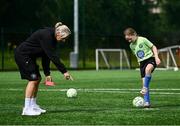 16 July 2025; Republic of Ireland WNT head coach Carla Ward with Maggie Homan on a visit to the MiWadi FAI Football Camp at Leixlip United in Collinstown, Kildare. Photo by Piaras Ó Mídheach/Sportsfile