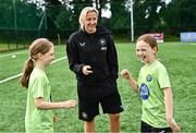 16 July 2025; Republic of Ireland WNT head coach Carla Ward with players Amy Mooney, left, and Maggie Homan on a visit to the MiWadi FAI Football Camp at Leixlip United in Collinstown, Kildare. Photo by Piaras Ó Mídheach/Sportsfile
