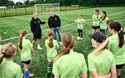 16 July 2025; Republic of Ireland WNT head coach Carla Ward and Republic of Ireland WNT assistant head coach Alan Mahon with players on a visit to the MiWadi FAI Football Camp at Leixlip United in Collinstown, Kildare. Photo by Piaras Ó Mídheach/Sportsfile